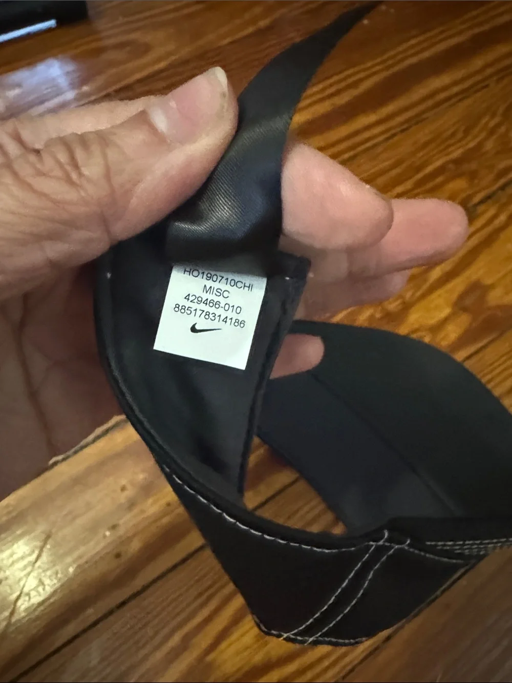Nike Men's Black Visor with White Swoosh Accent